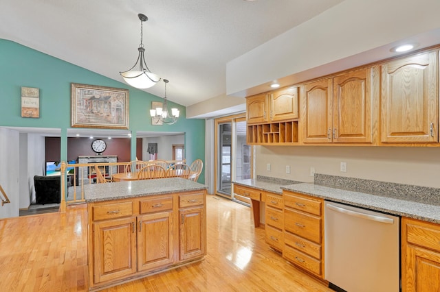 kitchen with light stone counters, hanging light fixtures, vaulted ceiling, and dishwasher