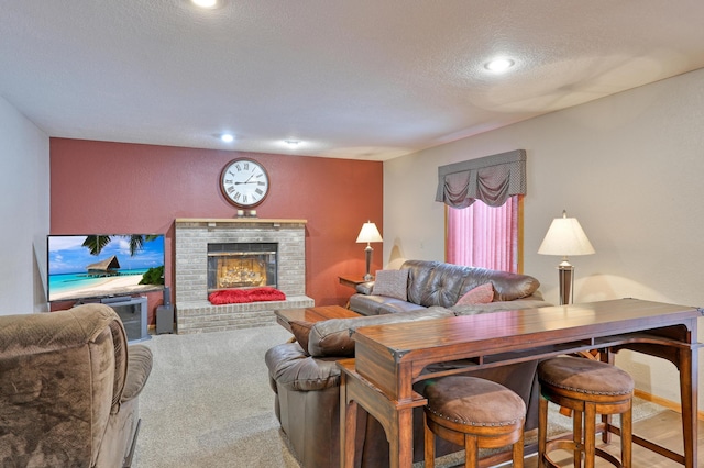 carpeted living room with a fireplace and a textured ceiling