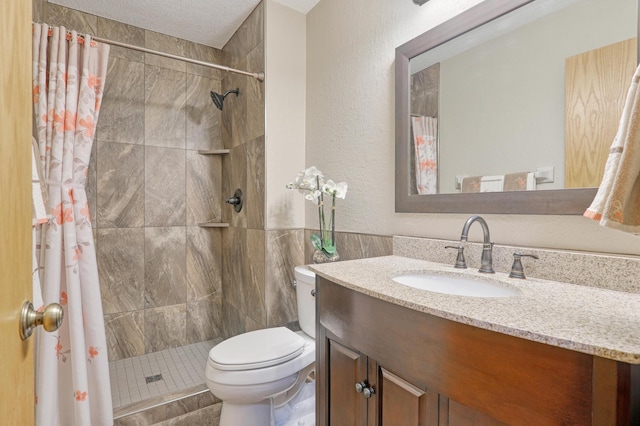 bathroom with tile walls, a shower with shower curtain, vanity, a textured ceiling, and toilet