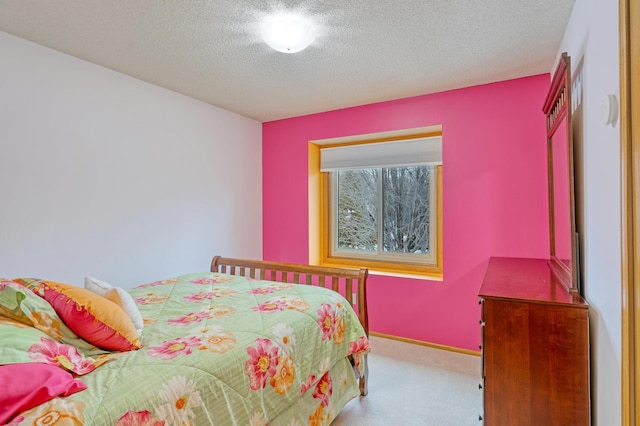 carpeted bedroom with a textured ceiling