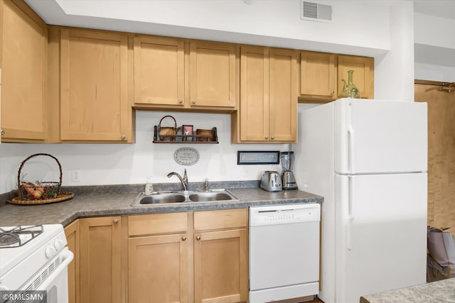 kitchen with sink, white appliances, and light brown cabinets