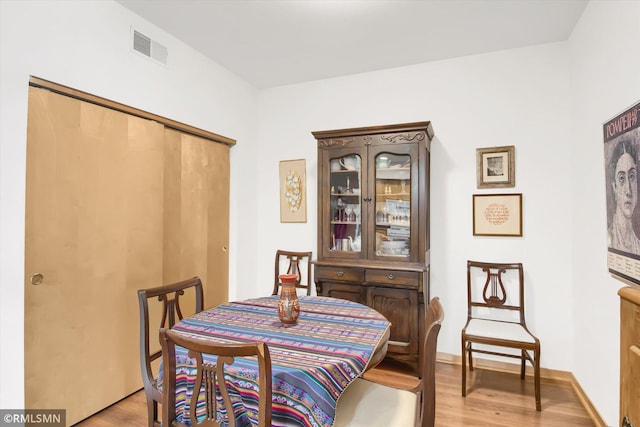 dining room with light hardwood / wood-style flooring