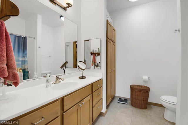 bathroom with toilet, vanity, walk in shower, and tile patterned flooring