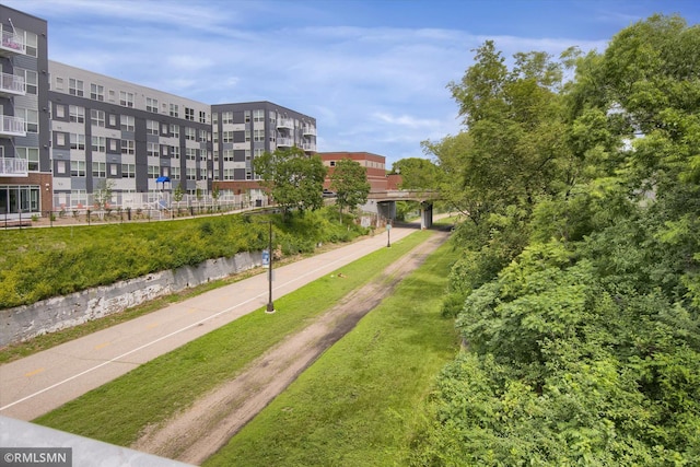 view of property's community with a lawn