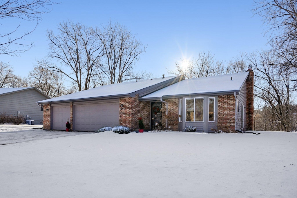 single story home featuring a garage