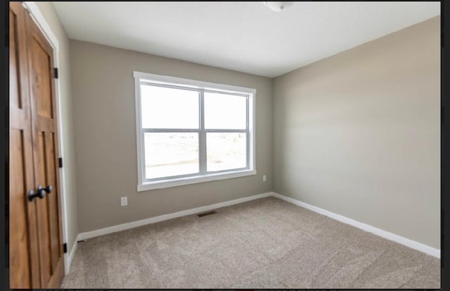 view of carpeted spare room