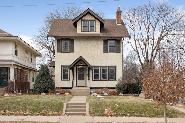 view of front of home with a front lawn