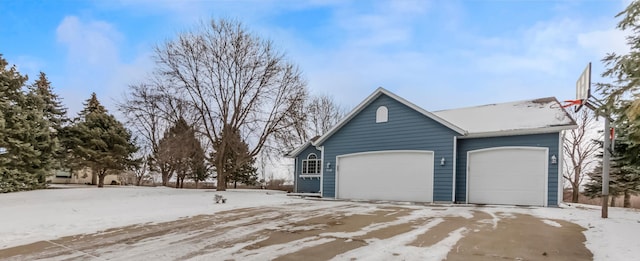 view of snow covered garage