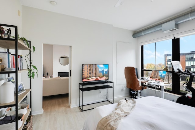 bedroom with light wood-type flooring