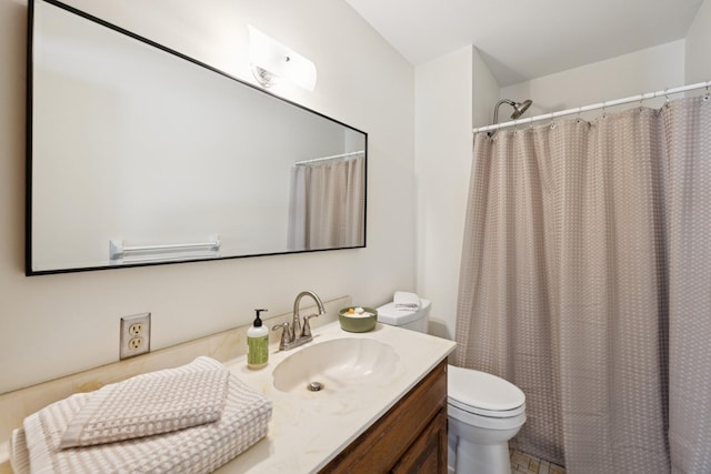 full bathroom with vanity, a shower with shower curtain, and toilet