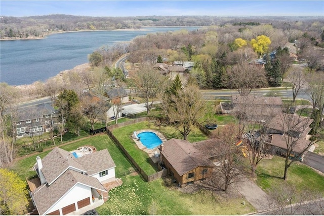 birds eye view of property with a water view