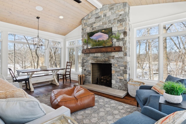 living area with wood ceiling, a stone fireplace, wood finished floors, high vaulted ceiling, and beamed ceiling