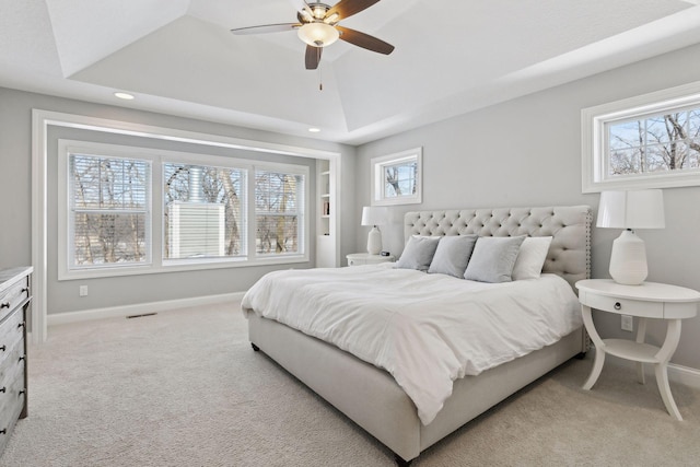 bedroom with visible vents, a ceiling fan, light carpet, vaulted ceiling, and baseboards