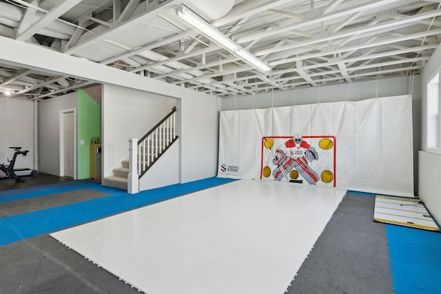 finished basement featuring stairs