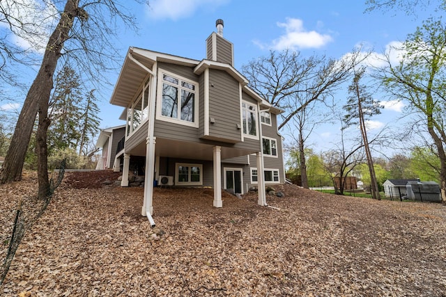 297 Glenbrook Rd N, Wayzata, MN 55391 - rear view of house with a chimney