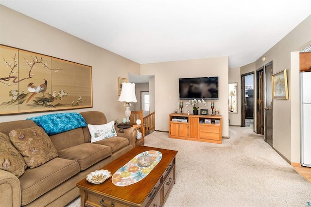 living room with light colored carpet