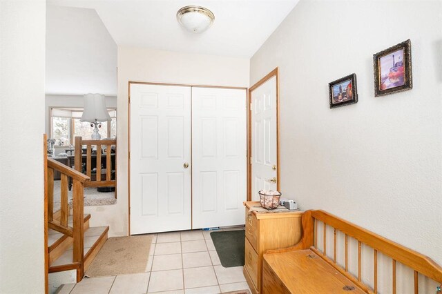 foyer featuring light tile patterned flooring