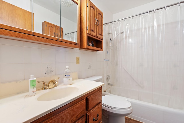 full bathroom with toilet, tasteful backsplash, shower / tub combo with curtain, and vanity