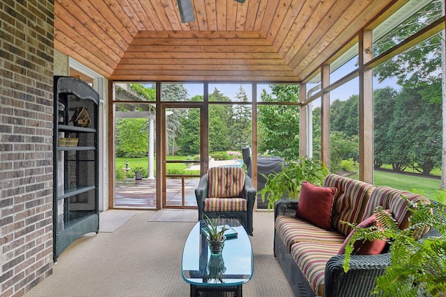 sunroom with wooden ceiling and vaulted ceiling