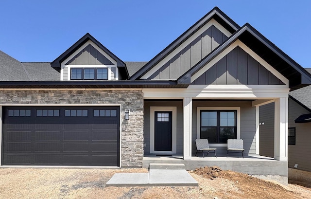 18513 Ifton Way, Lakeville, MN 55044 - view of front facade with a porch, board and batten siding, an attached garage, and driveway