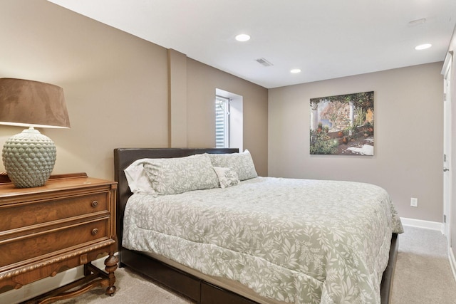 bedroom with visible vents, recessed lighting, baseboards, and carpet