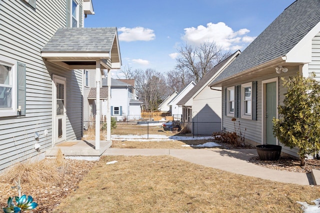 view of yard with a residential view and fence