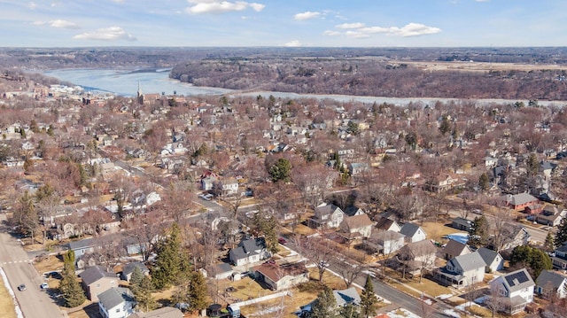 drone / aerial view with a water view and a residential view