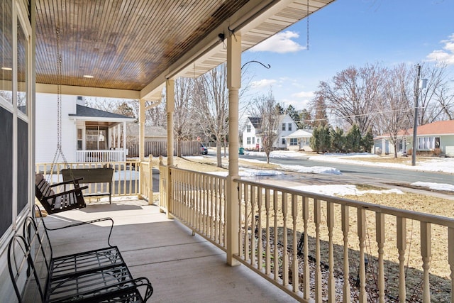 balcony featuring a residential view and covered porch