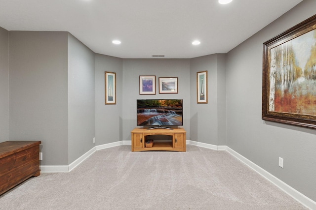 living area with recessed lighting, baseboards, and light colored carpet