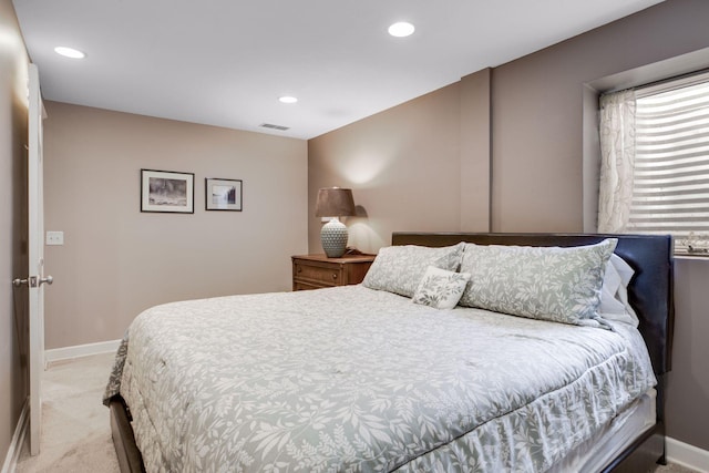 bedroom featuring light carpet, visible vents, recessed lighting, and baseboards