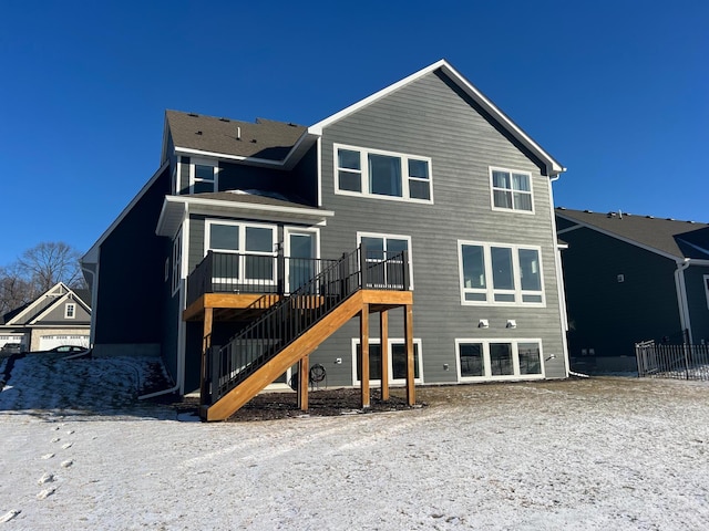 back of house with a wooden deck