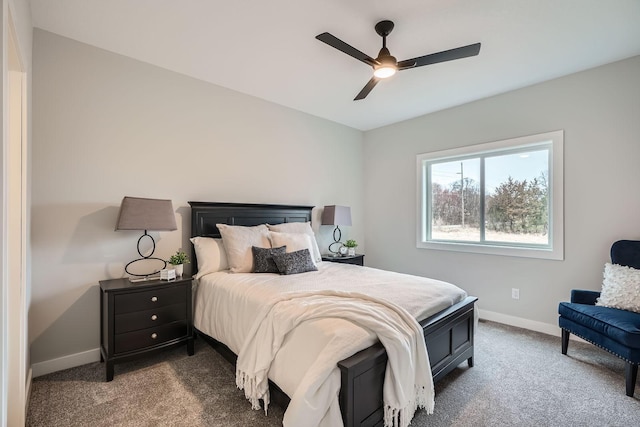 carpeted bedroom featuring a ceiling fan and baseboards
