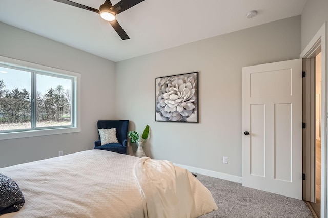 bedroom with baseboards, ceiling fan, and carpet