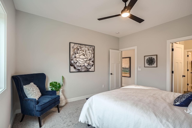 carpeted bedroom with a ceiling fan and baseboards