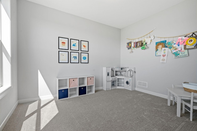 game room featuring carpet floors, visible vents, and baseboards