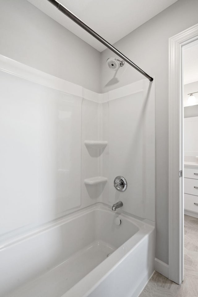 bathroom with washtub / shower combination