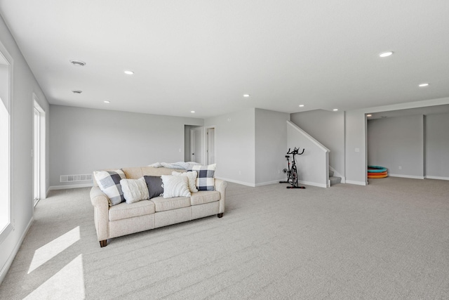 living area featuring stairs, baseboards, visible vents, and recessed lighting