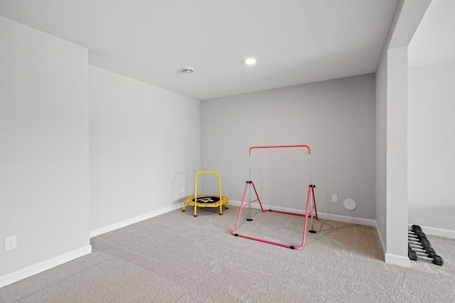 playroom with carpet floors, recessed lighting, and baseboards