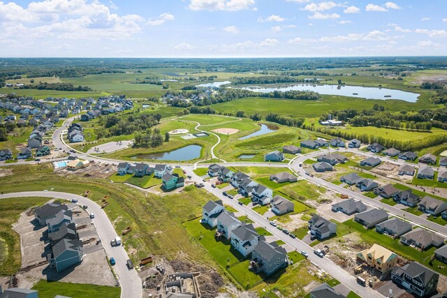 aerial view featuring a water view and a residential view