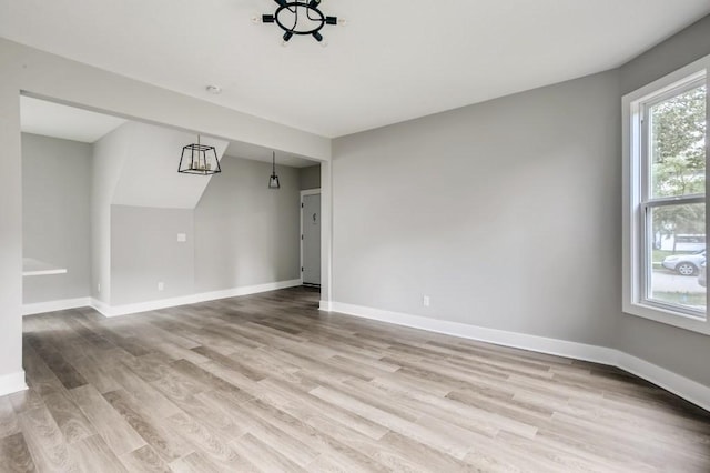 spare room with light wood-type flooring