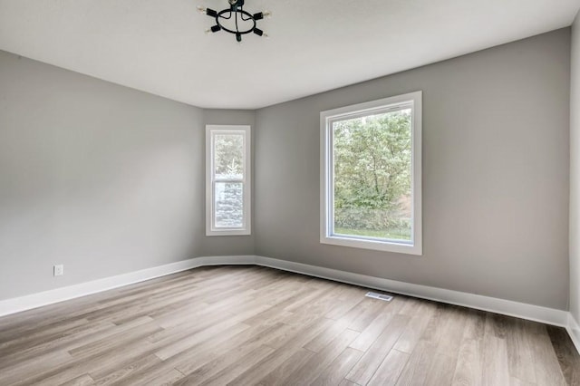 empty room with light wood-type flooring