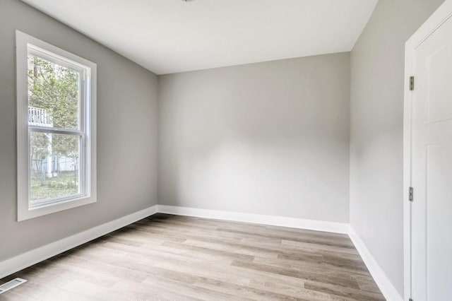 spare room featuring light hardwood / wood-style flooring