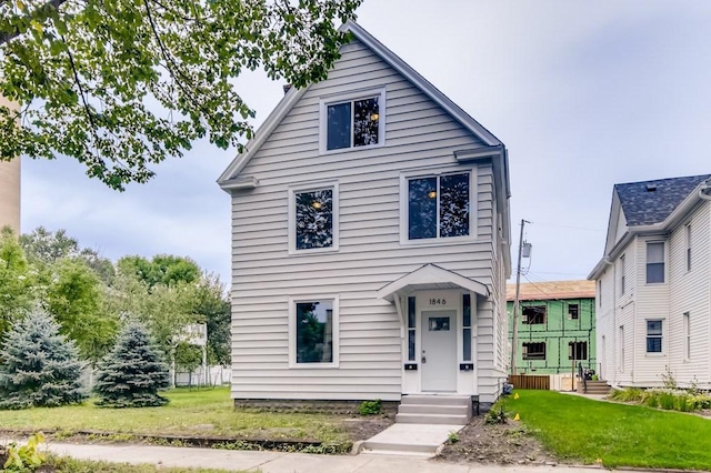 view of front facade featuring a front yard