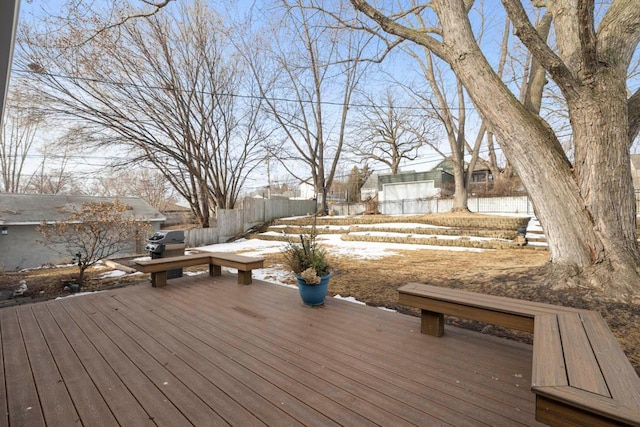 wooden deck featuring area for grilling and fence