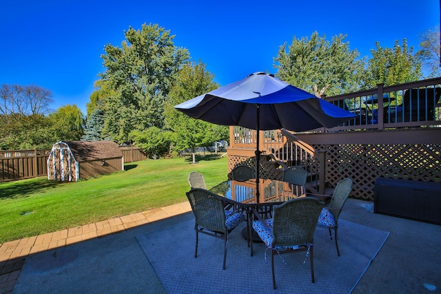 view of patio featuring a storage shed