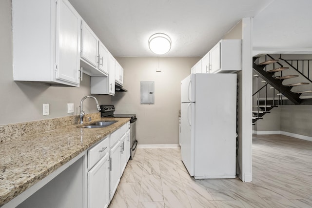 kitchen with sink, light stone counters, stainless steel electric range, white refrigerator, and white cabinets