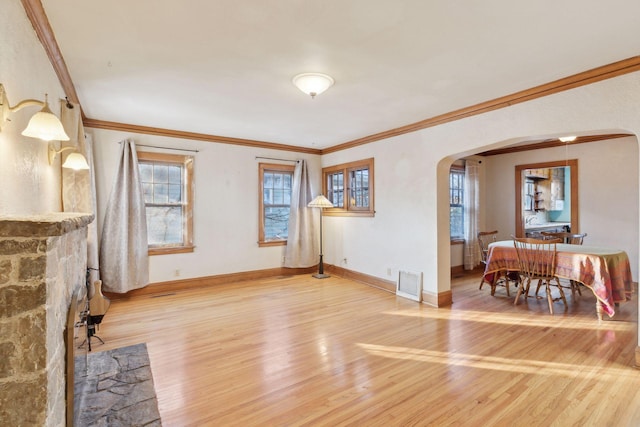 living room featuring hardwood / wood-style flooring and crown molding