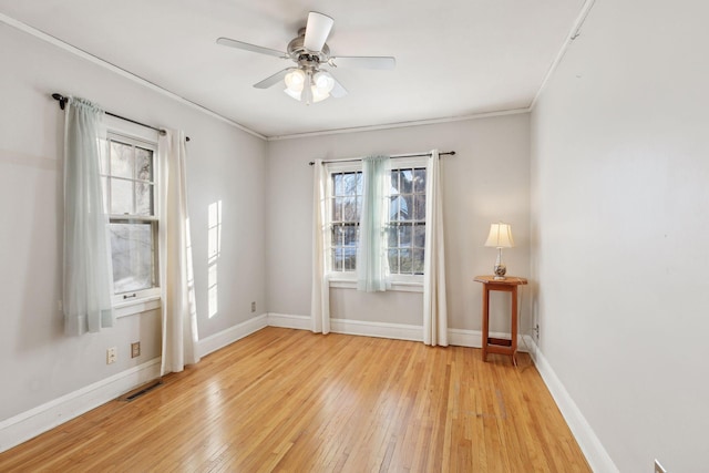 unfurnished room with light wood-type flooring, ceiling fan, and ornamental molding