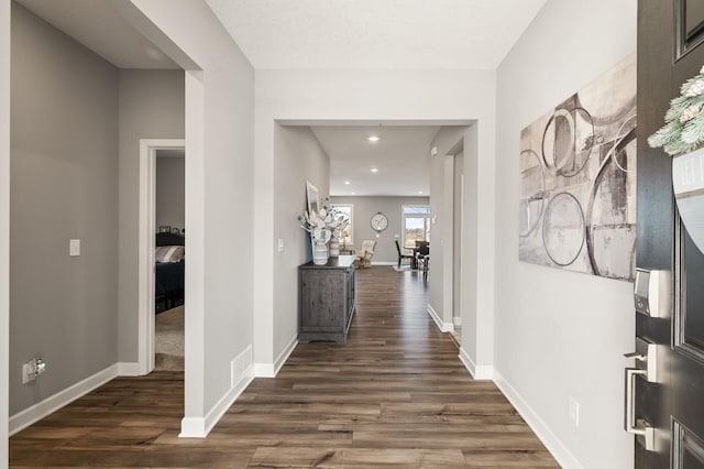 corridor featuring dark hardwood / wood-style floors