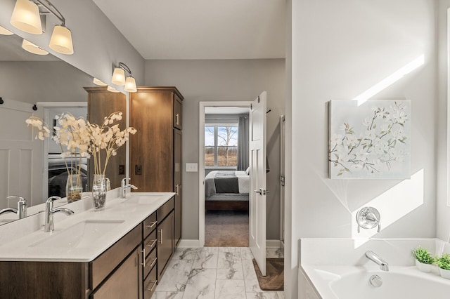 bathroom with vanity and a bathtub